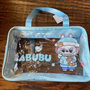 Clear Blue Tote Bag with Labubu Character type face on it.
